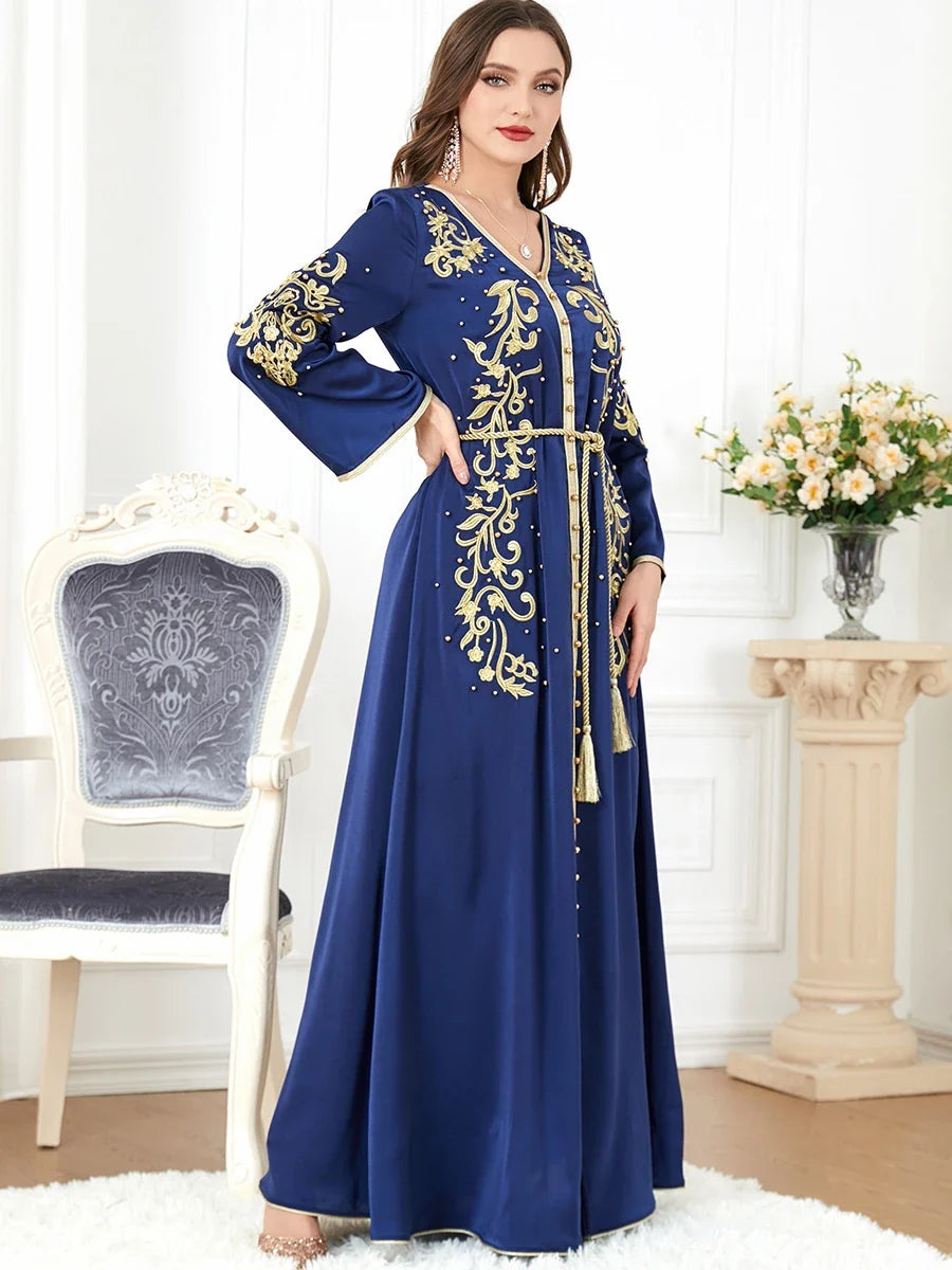 A sophisticated long-sleeve women's dress with a captivating floral embroidery pattern and a refined colour palette, suitable for a variety of occasions.