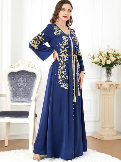 A sophisticated long-sleeve women's dress with a captivating floral embroidery pattern and a refined colour palette, suitable for a variety of occasions.