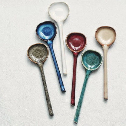 Elegant British ceramic soup spoon with long handle and vibrant glaze for refined dining experience