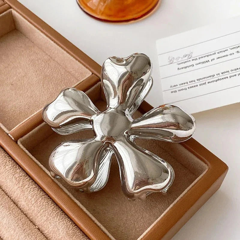 Gold floral metal hair claws - chic hair accessories for women with modern design and natural elegance