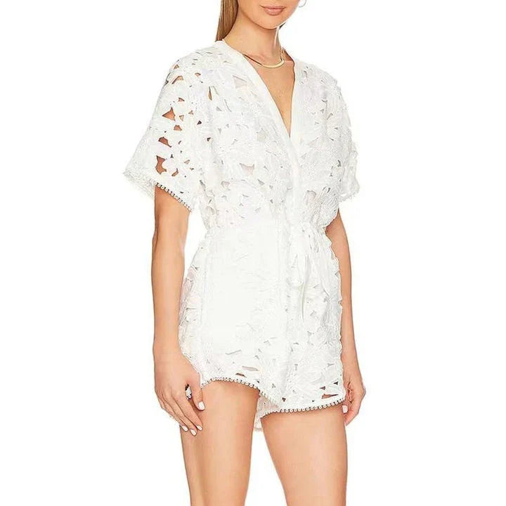 Elegant embroidered playsuit with hollow-out details, perfect for British summer style