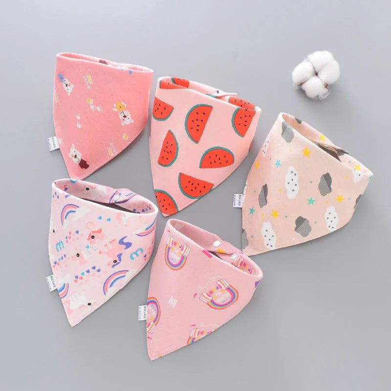 A set of fashionable cotton baby bandana bibs in various prints and colours, designed to keep your little one dry and stylish.