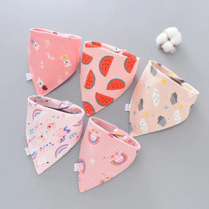 A set of fashionable cotton baby bandana bibs in various prints and colours, designed to keep your little one dry and stylish.