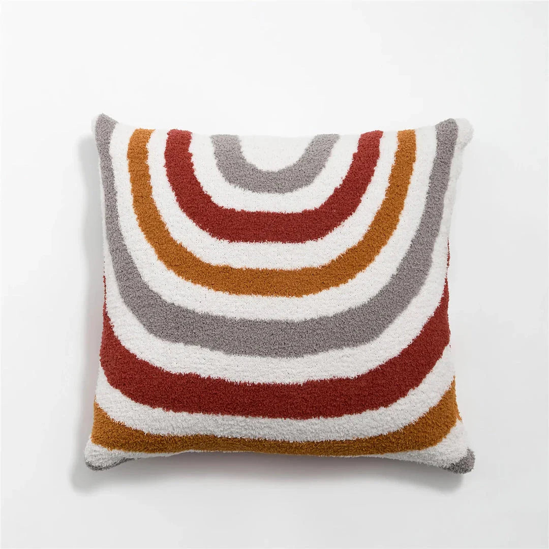 Bohemian-inspired microfibre cushion cover in light pink and white with a cosy, fuzzy texture