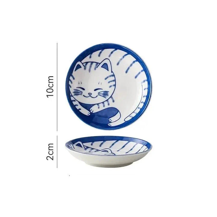 Charming Japanese ceramic sauce dish with a lucky cat design, perfect for serving sauces, sushi, and more.
