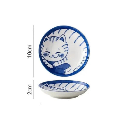 Charming Japanese ceramic sauce dish with a lucky cat design, perfect for serving sauces, sushi, and more.