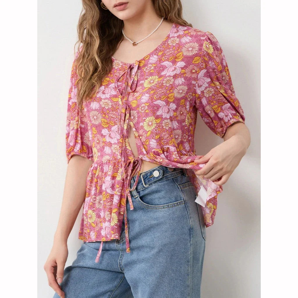 Elegant floral lace-up bow blouse with unique hollow-out details and a delicate floral print