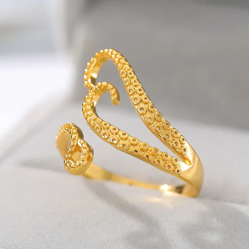 Elegant adjustable wrap ring with a detailed octopus tentacle design, made from durable stainless steel.