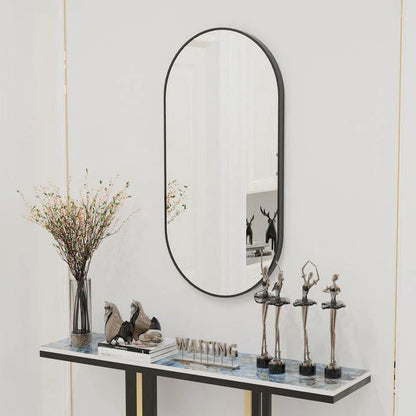 Elegant black oval-shaped wall mirror with a modern and sophisticated design, perfect for bathroom, entryway, and living room decor.