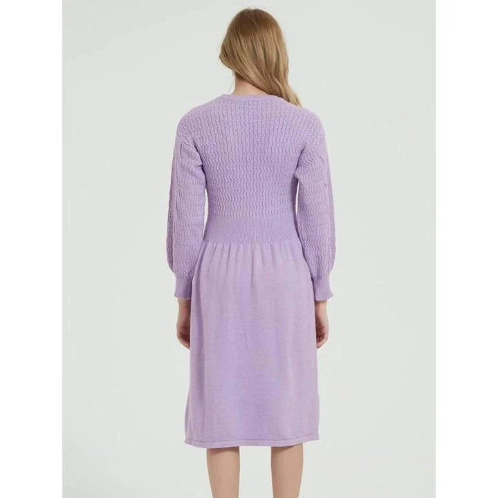 Elegant long sleeve knitted sweater dress in red with a classic A-line silhouette and mid-calf length