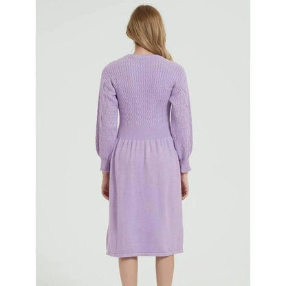 Elegant long sleeve knitted sweater dress in red with a classic A-line silhouette and mid-calf length