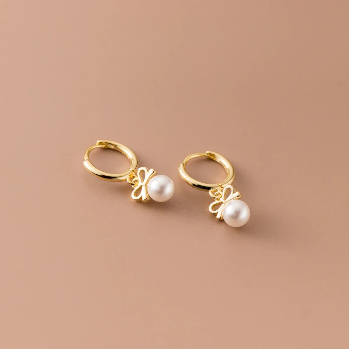Elegant sterling silver earrings with a delicate butterfly design, inspired by Japanese and Korean fashion