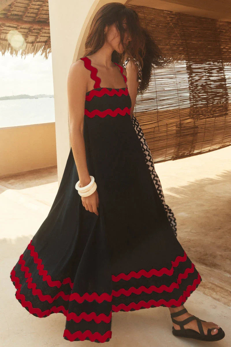 Elegant floral print suspender midi dress in black, perfect for summer beach holidays in the UK