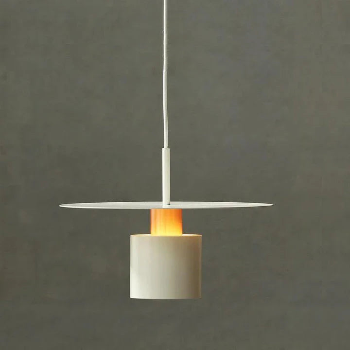 A modern and elegant minimalist pendant light made of durable metal with a smooth painted finish, providing focused and cosy illumination for a variety of interior spaces.