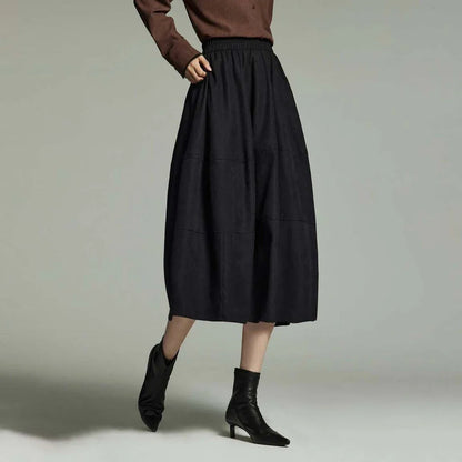 A stylish and sophisticated mid-length A-line pleated skirt with pockets, crafted from high-quality twill fabric for durability and comfort.