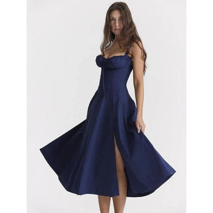 Elegant backless midi sundress in blue, featuring a stylish high split and mid-calf length for a sophisticated summer look.