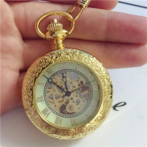 Elegant mechanical pocket watch with a golden pattern, showcasing British craftsmanship and timeless style.