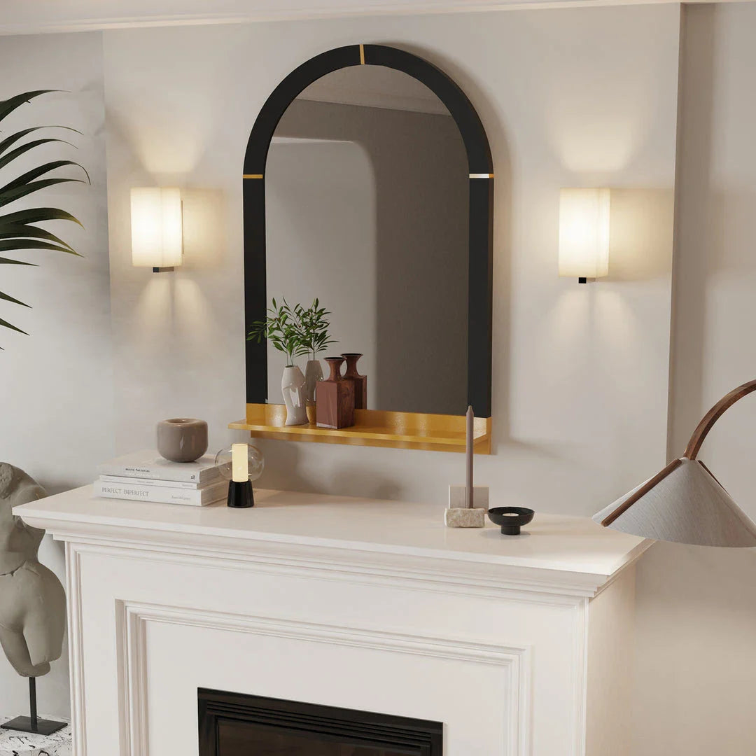 Elegant arched black and gold wall mirror with decorative shelf for home decor