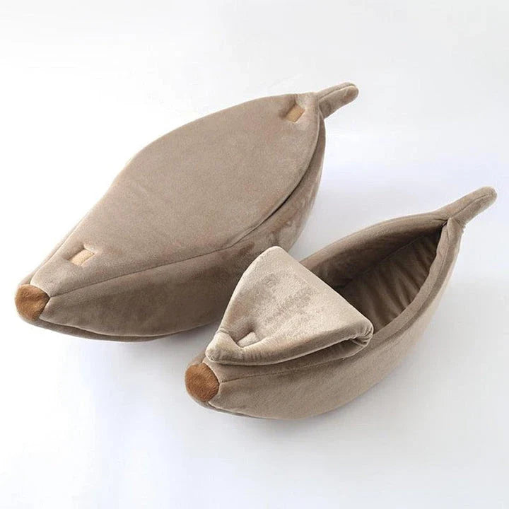 A cosy, banana-shaped cat bed made of plush, supportive materials in various vibrant colours to provide a comfortable and stylish retreat for feline friends.