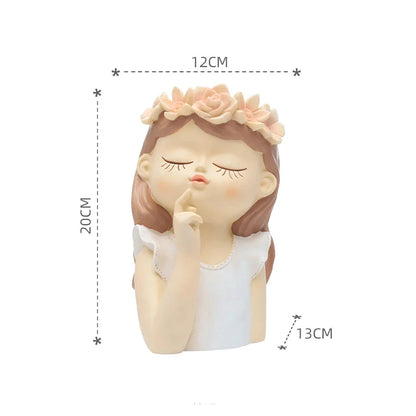 A charming 7.8-inch resin planter in the shape of a fairy girl, perfect for displaying succulents and adding whimsical decor to your home or office.