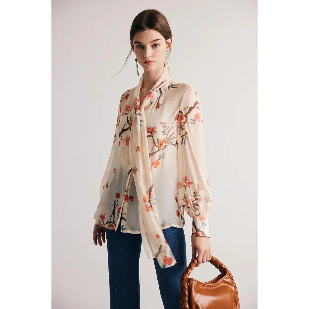 Elegant floral pattern silk and viscose blend blouse with bow collar and puff sleeves