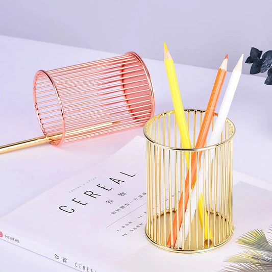 Rose gold plated pen holder with a sleek, minimalist design for organising pens, makeup brushes, and other desk accessories