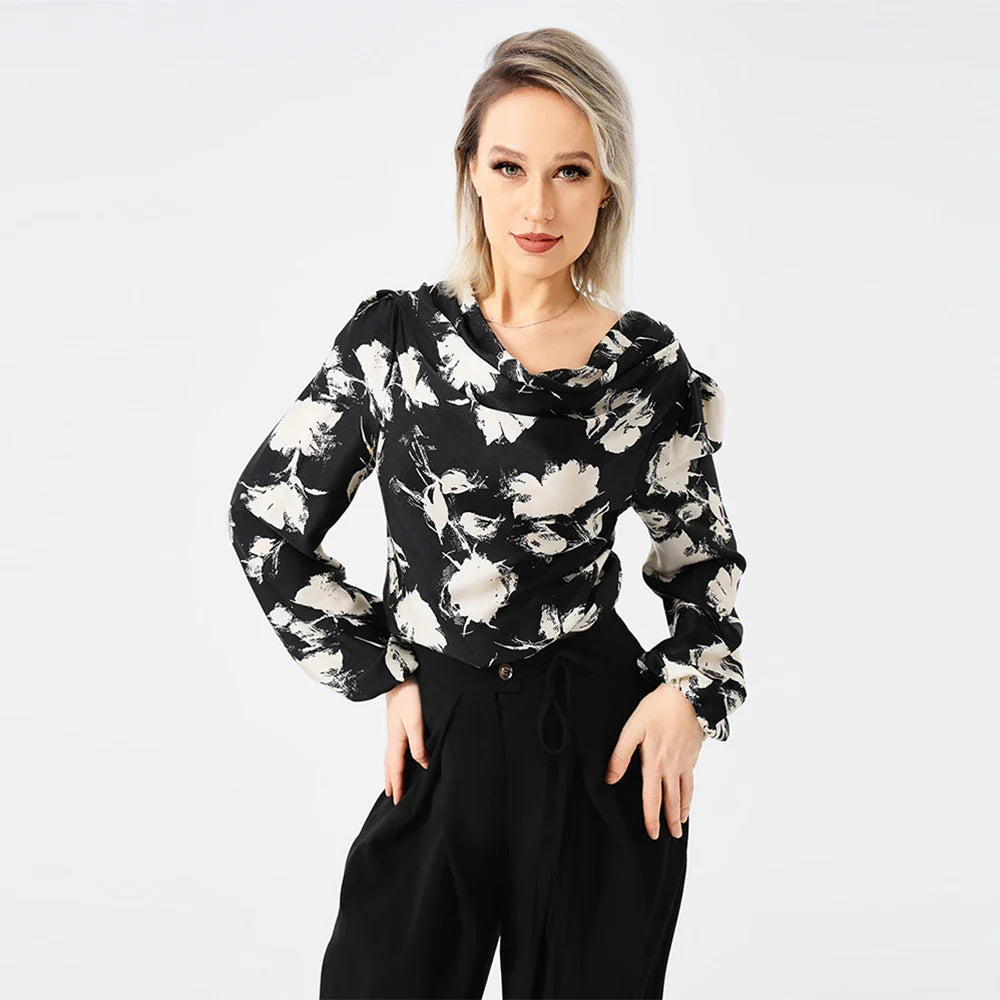 Elegant ladies' blouse with a printed pattern, dropped collar, and long sleeves in a classic white colour