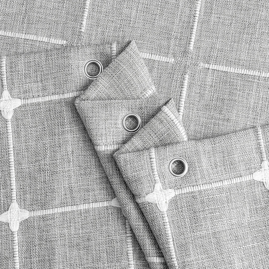 Elegant jacquard linen shower curtain with a geometric pattern and charming tassel accents, available in multiple sizes and colours for a premium bathroom upgrade.