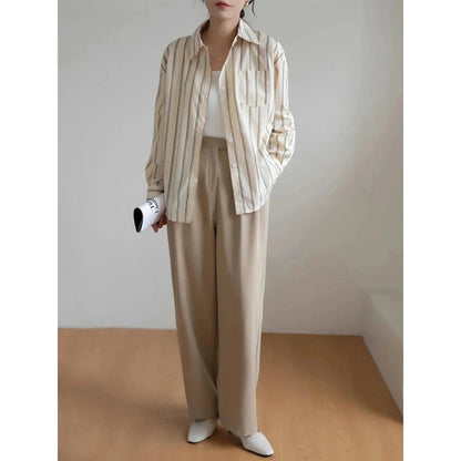 Elegant striped office blouse with chic drop shoulder design, made from premium polyester-cotton blend for durability and comfort