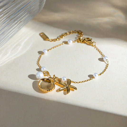 Elegant 18K gold-plated bracelet with a pearl starfish pendant on a snake bone chain