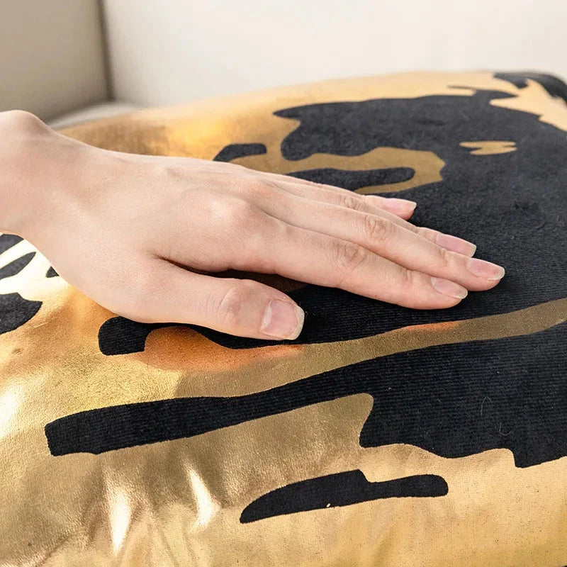 Pair of Nordic-inspired geometric plush pillowcases with a luxurious gold pattern on a white and black background