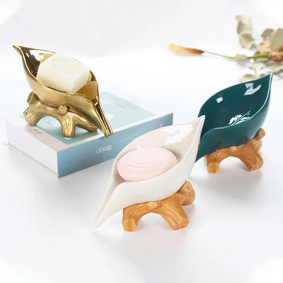 Elegant ceramic leaf-shaped soap holder with a sturdy base, adding a touch of nature-inspired sophistication to any bathroom
