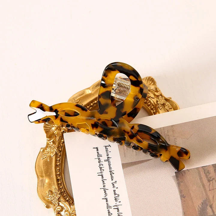 Elegant leopard print large weave hair clip made of high-quality acrylic and alloy materials for a stylish and secure hairstyle