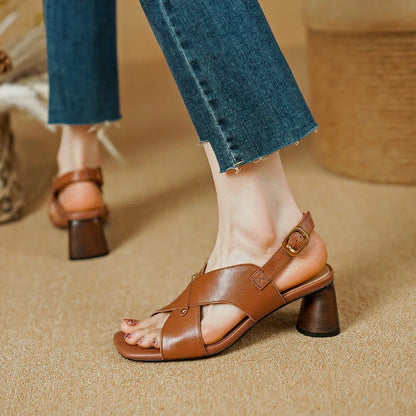 Elegant leather high heel sandals in khaki colour for women, featuring a 5.5 cm square heel, secure buckle strap, and sleek design.