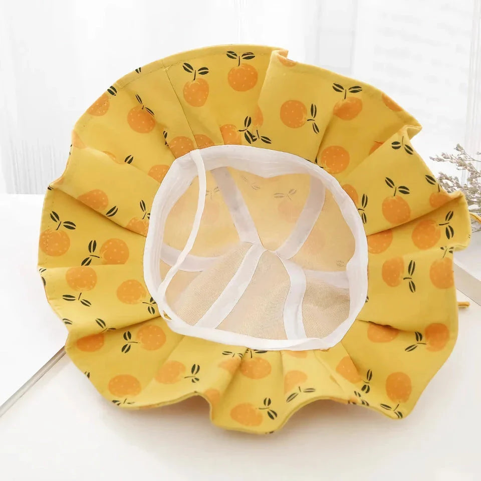 Adjustable cotton sun protection bucket hats for children with whimsical cartoon designs