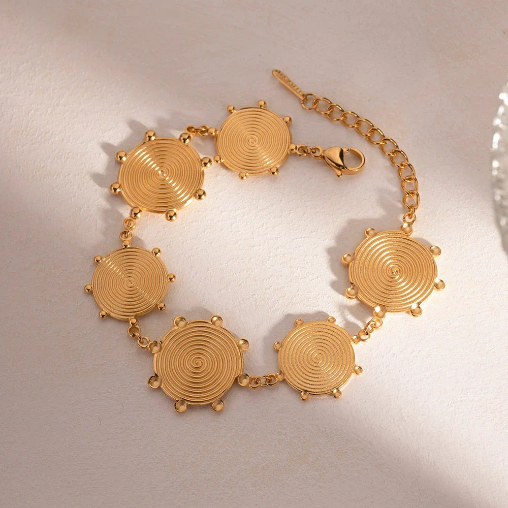 Close-up of a luxurious 18K gold plated stainless steel bracelet with an elegant palace-style design