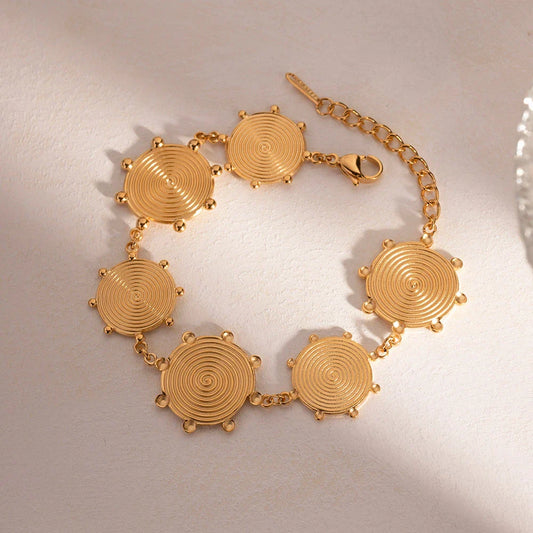 Close-up of a luxurious 18K gold plated stainless steel bracelet with an elegant palace-style design