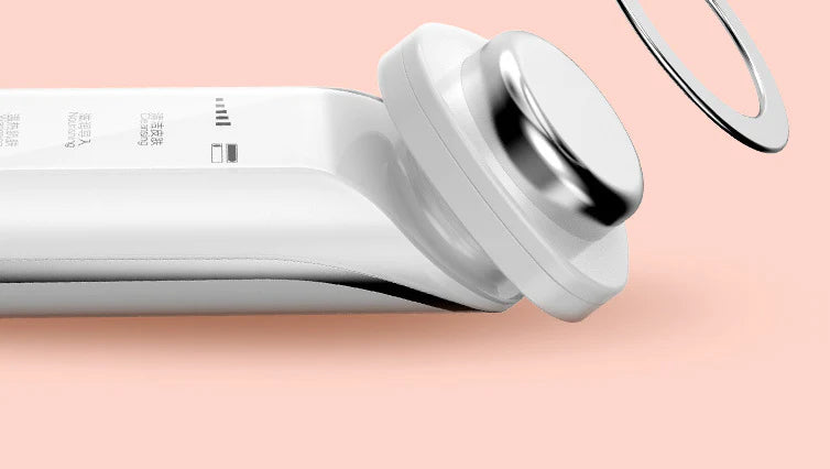 Sleek, modern facial cleansing device with versatile attachments for effective blackhead removal and deep pore cleansing