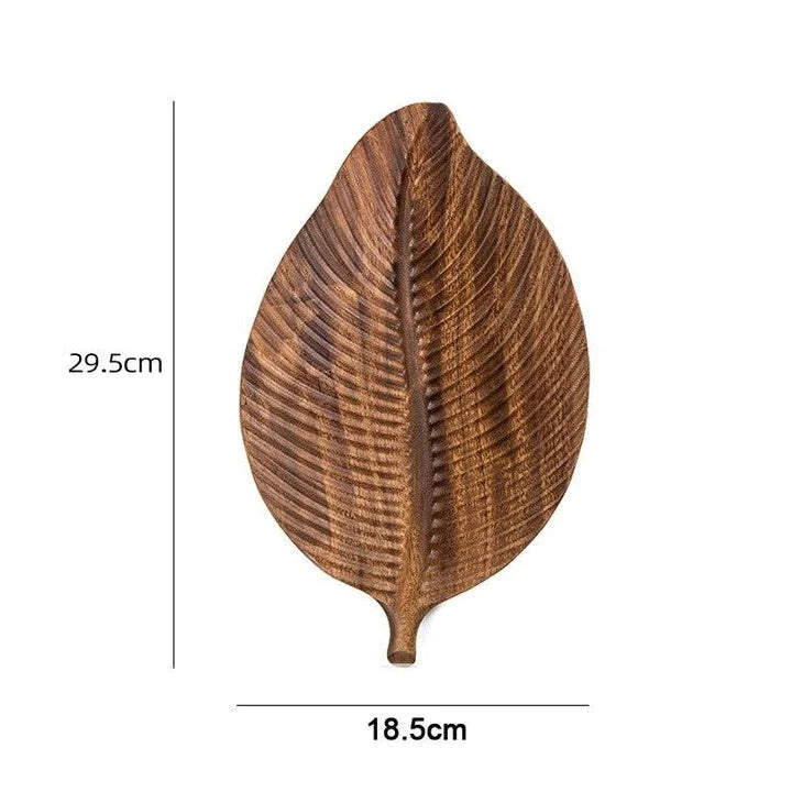 Elegant leaf-shaped serving platter made of solid oak wood, featuring a natural and stylish design for hosting and entertaining