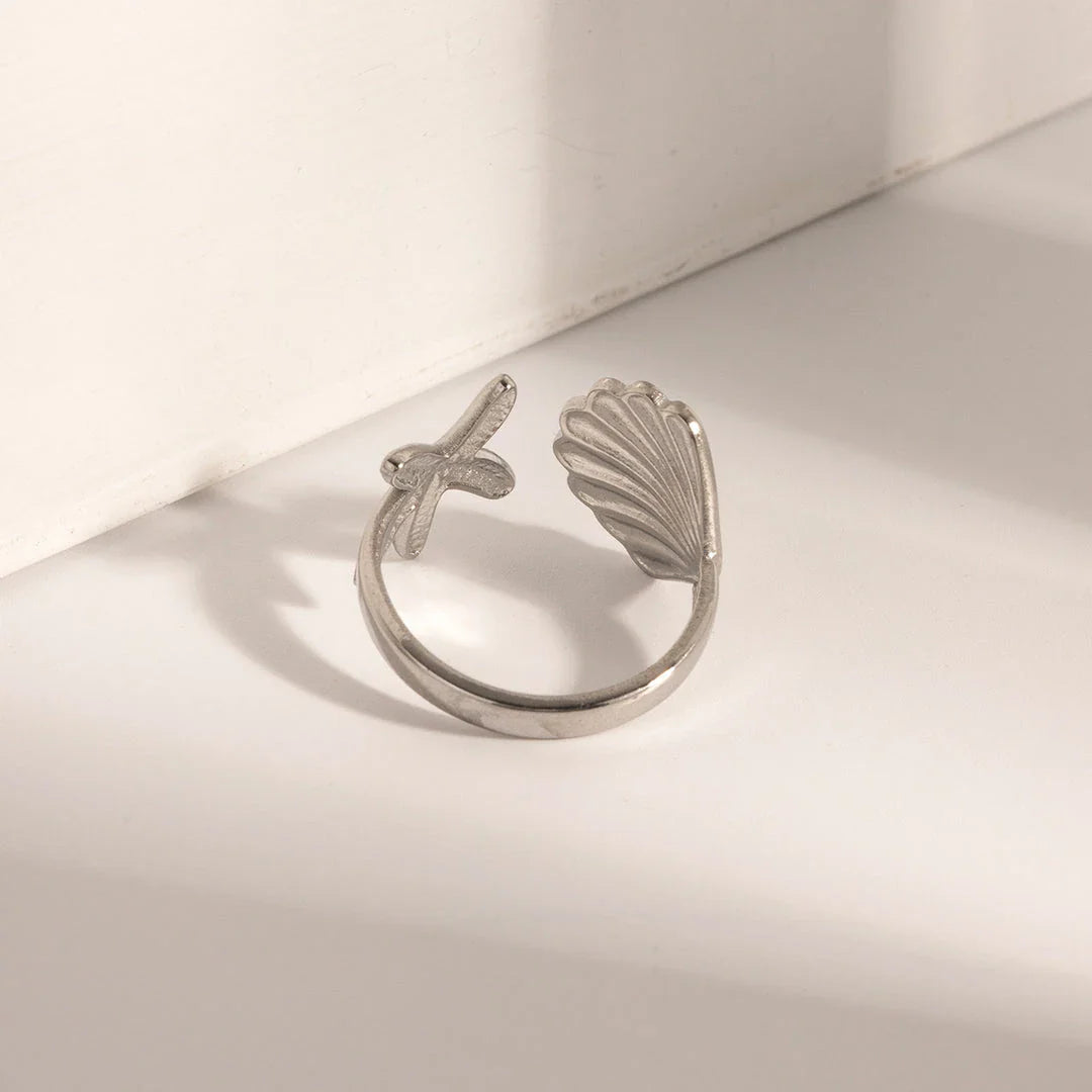 Adjustable stainless steel ring with starfish and shell accents, perfect for beach and casual wear