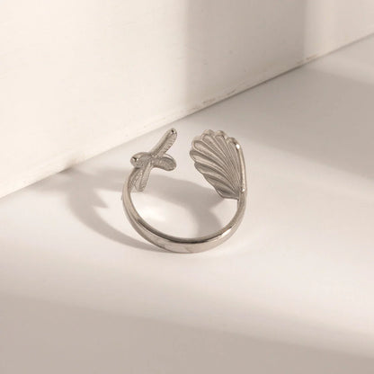 Adjustable stainless steel ring with starfish and shell accents, perfect for beach and casual wear