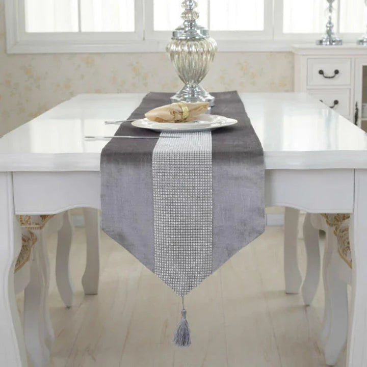 Elegant crystal-trimmed table runner with 4 coordinating beige placemats, creating a refined and sophisticated dining setting