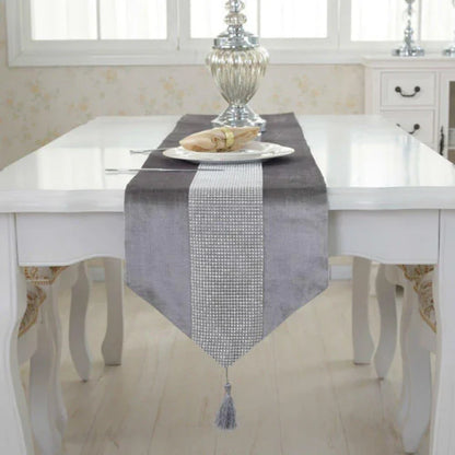 Elegant crystal-trimmed table runner with 4 coordinating beige placemats, creating a refined and sophisticated dining setting