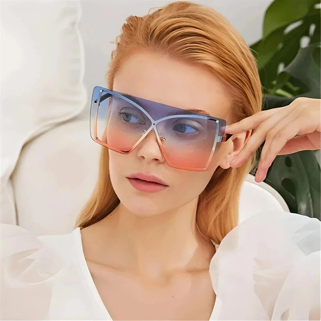 Stylish oversized flat top sunglasses with a rimless design, providing UV protection and a comfortable fit for the modern British woman