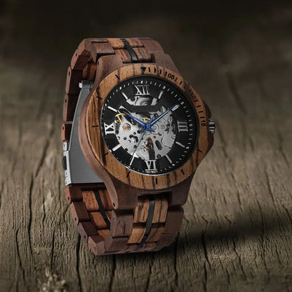 Elegant mechanical watch with wood strap, stainless steel buckle, and pointer display, showcasing British craftsmanship and precision timekeeping.