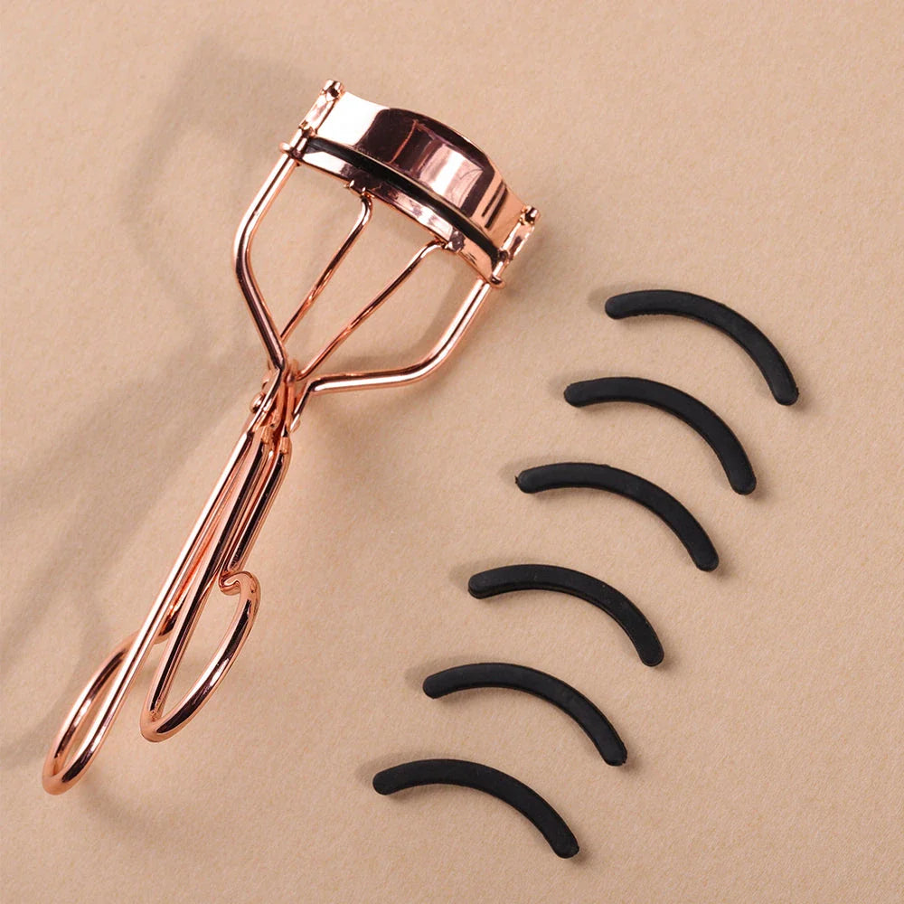 Rose gold eyelash curler with a silicone pad for gentle, long-lasting lash curling