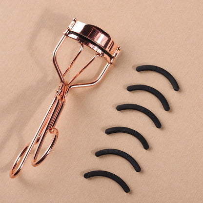 Rose gold eyelash curler with a silicone pad for gentle, long-lasting lash curling