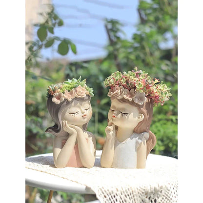 A charming 7.8-inch resin planter in the shape of a fairy girl, perfect for displaying succulents and adding whimsical decor to your home or office.