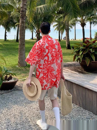 A stylish red short-sleeve shirt with a retro vine print pattern, perfect for casual British-inspired fashion.