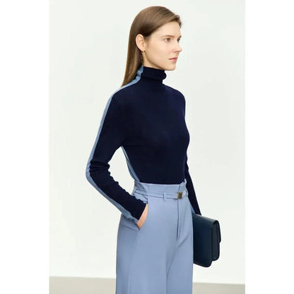 A cosy and stylish turtleneck sweater with a unique patchwork design, made from a premium wool blend for exceptional comfort and elegance.